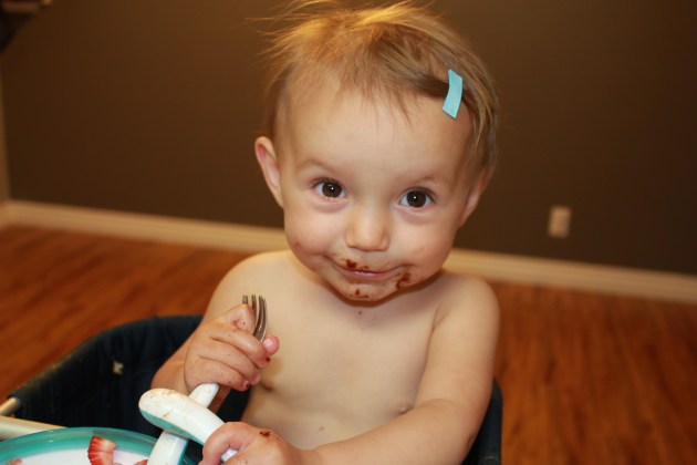 Enjoying your birthday breakfast. A chocolate chip waffle with strawberries and powdered sugar!